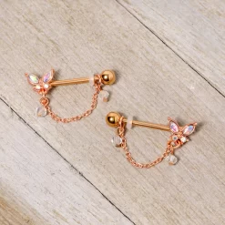 Gaby 14 Gauge 5/8 Aurora Gem Rose Gold Tone Butterfly Dangle Nipple Ring Set 6 Gaby 14 Gauge 5/8 Aurora Gem Rose Gold Tone Butterfly Dangle Nipple Ring Set -Body Jewelry Store 67576.otherimage2 f4bd1aaa 7577 45b9 9876 dac336eb9ab6