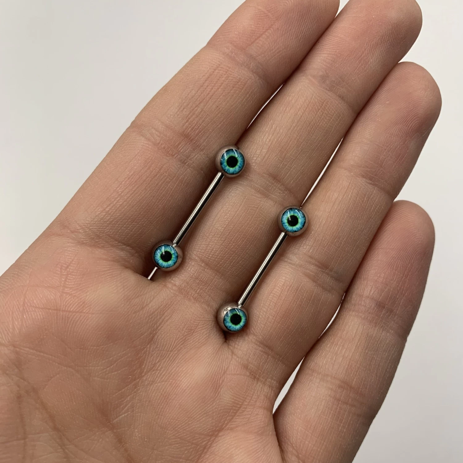 14 Gauge 5/8 Haunting Human Blue Eyeball Halloween Nipple Ring Set 3 14 Gauge 5/8 Haunting Human Blue Eyeball Halloween Nipple Ring Set - Image 3