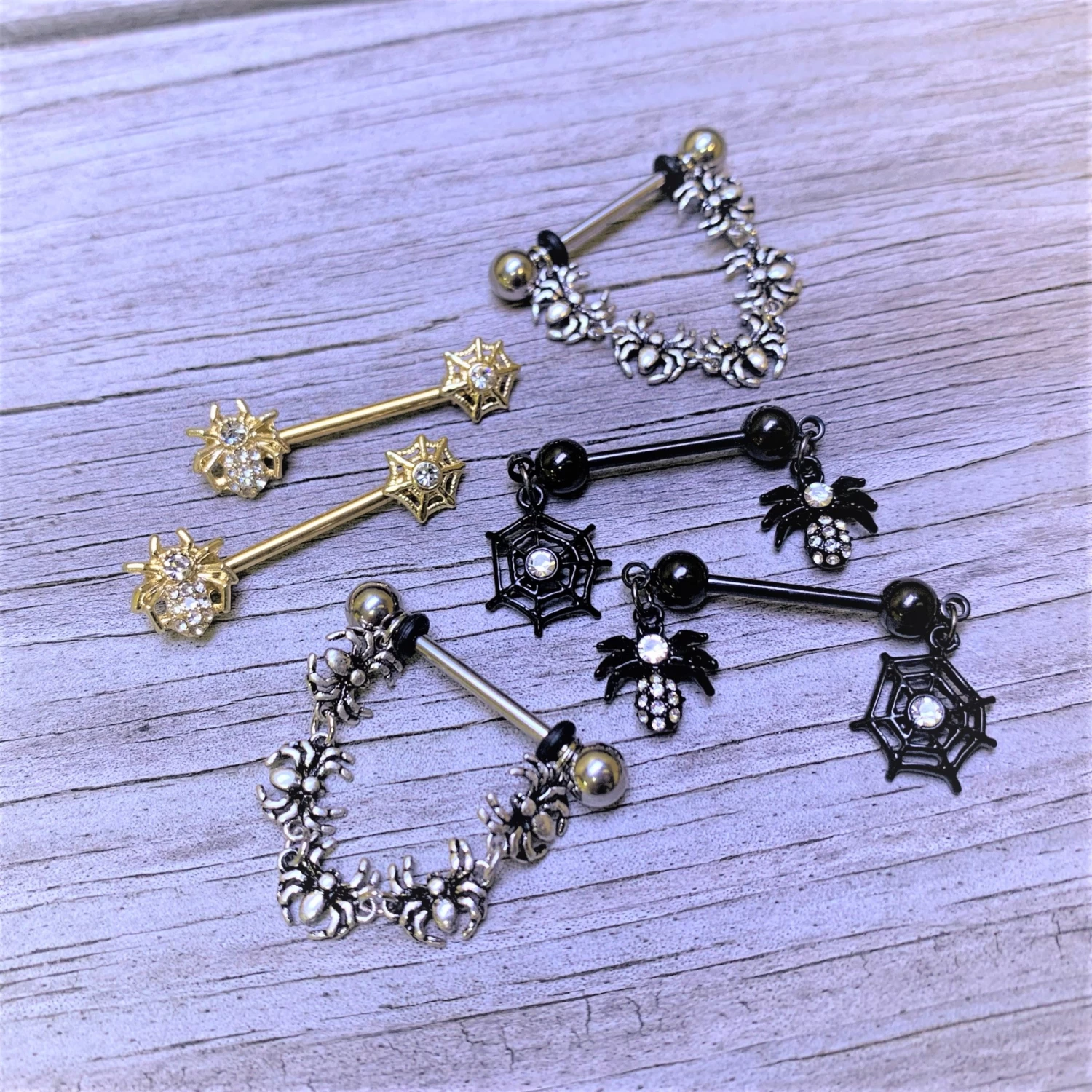 14 Gauge 5/8 Clear Gem Gold Tone Spider Web Barbell Nipple Ring Set 2 14 Gauge 5/8 Clear Gem Gold Tone Spider Web Barbell Nipple Ring Set - Image 2