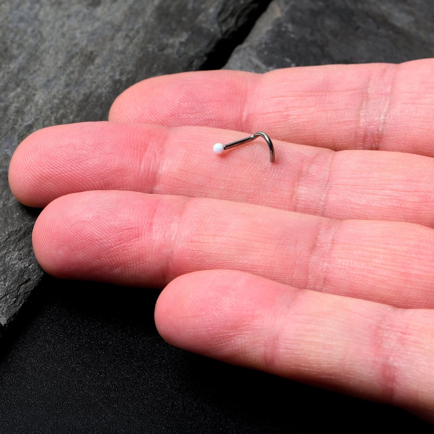 18 Gauge 1/4 White Synth Opal G23 Titanium Threadless Left Nose Screw 4 18 Gauge 1/4 White Synth Opal G23 Titanium Threadless Left Nose Screw - Image 4