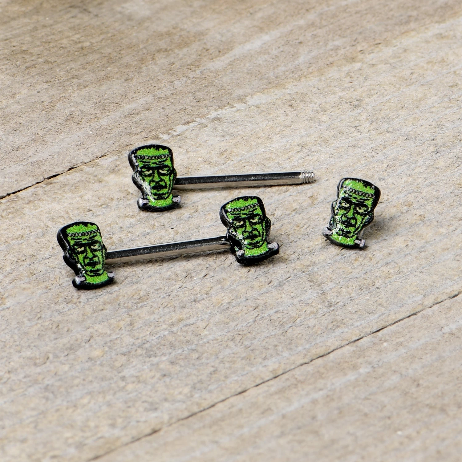 14 Gauge 9/16 Frankenstein Head Green Glow In The Dark Nipple Ring Set 6 14 Gauge 9/16 Frankenstein Head Green Glow In The Dark Nipple Ring Set - Image 6