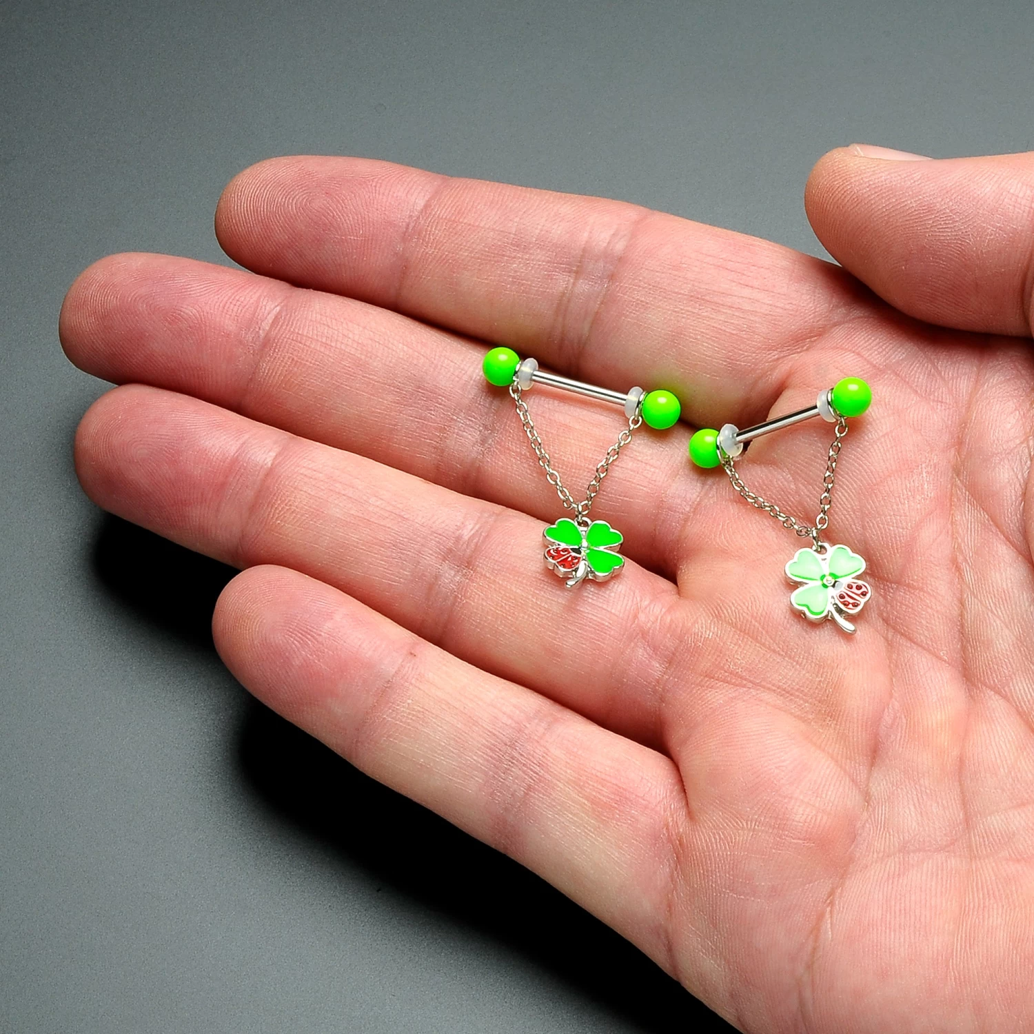 Gaby 14 Gauge 11/16 Ladybug Shamrock UV Glow Chain Dangle Nipple Ring Set 2 Gaby 14 Gauge 11/16 Ladybug Shamrock UV Glow Chain Dangle Nipple Ring Set - Image 2